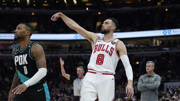 Chicago Bulls guard Zach LaVine (8) watches his three point basket go in as Portland Trail Blazers guard Damian Lillard (0) 